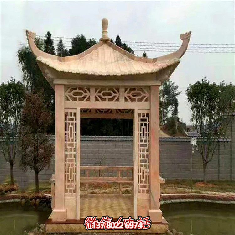 紅石雕鏤涼亭，晚霞中空中創意雕塑